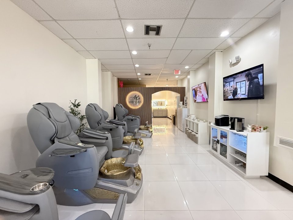 Clean nail salon workstation with manicure tools.